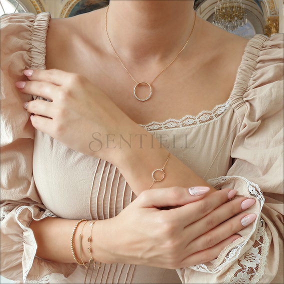 Silver bracelet with a tag and round pendant - adjusted length