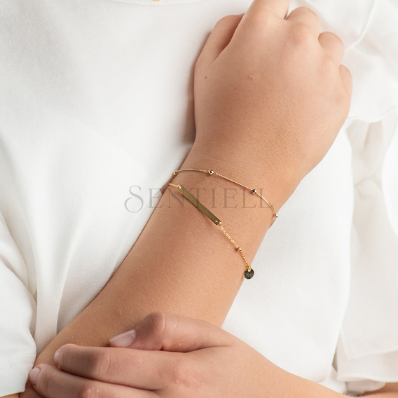 Silver bracelet with a tag and round pendant - adjusted length