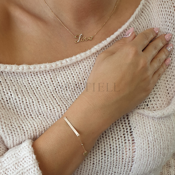 Silver bracelet with a tag and round pendant - adjusted length