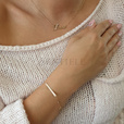 Silver bracelet with a tag and round pendant - adjusted length